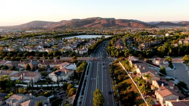 Aerial view of residential modern subdivision luxury house neighborhood during sunset. South California, USA