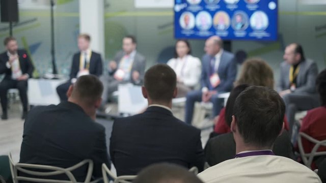 Audience listen speakers at business forum