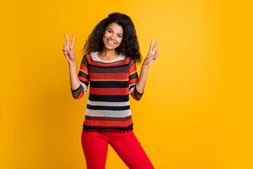 Portrait of her she nice attractive lovely girlish cheerful cheery wavy-haired girl in knitted sweater showing double v-sign isolated on bright vivid shine vibrant yellow color background