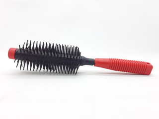 Red and Black Plastic Hair Comb for Brushing Fashion and Beauty Appliances in White Isolated...