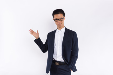 Young Asian business male standing in front of white background