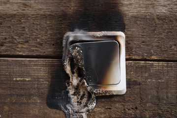melting switch close-up. The fire was caused by a short circuit. Electric short curcuit. the fire is real