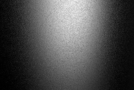Ground glass texture with light in black and white.