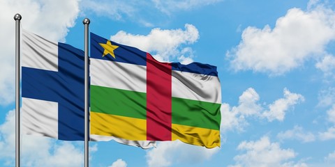 Finland and Central African Republic flag waving in the wind against white cloudy blue sky together. Diplomacy concept, international relations.