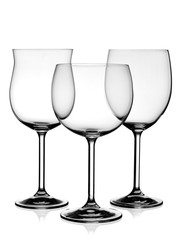 Three empty clear wine glasses