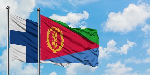Finland and Eritrea flag waving in the wind against white cloudy blue sky together. Diplomacy concept, international relations.