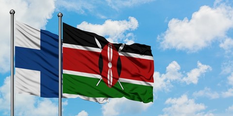 Finland and Kenya flag waving in the wind against white cloudy blue sky together. Diplomacy concept, international relations.