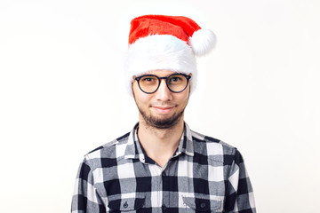 X-mas, winter holidays and people concept - funny man in santa claus hat over white background