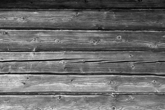 Old grungy wooden planks background in black and white.