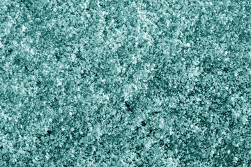 Fototapeta na wymiar Frost on car glass texture in cyan tone.