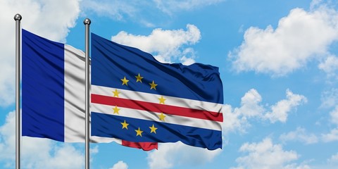 France and Cape Verde flag waving in the wind against white cloudy blue sky together. Diplomacy concept, international relations.