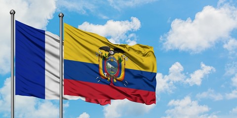 France and Ecuador flag waving in the wind against white cloudy blue sky together. Diplomacy concept, international relations.