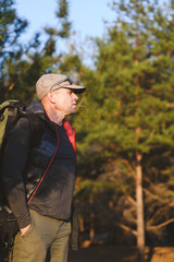 Portrait of handsome mature male tourist outdoors