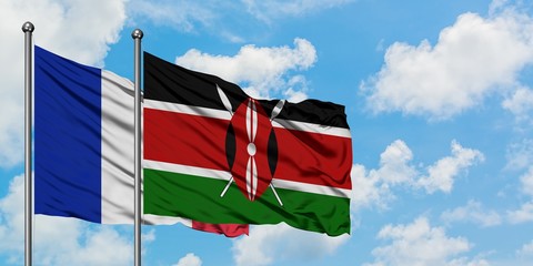 France and Kenya flag waving in the wind against white cloudy blue sky together. Diplomacy concept, international relations.