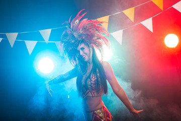 Holidays, party, dance and nightlife concept - Beautiful woman dressed for carnival night