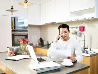 young asian man working from home