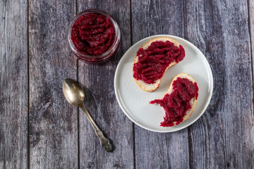 Sandwiches with natural, homemade beetroot jam, vanilla and sugar. Healthy food, vegetarianism.