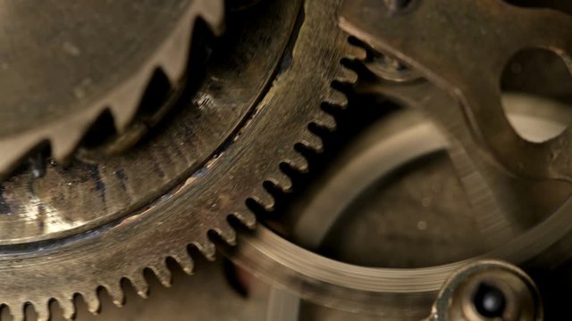 close-up spinning gears, Very similar to a clock mechanism or a working device in the old style. 4K
