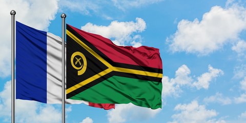 France and Vanuatu flag waving in the wind against white cloudy blue sky together. Diplomacy concept, international relations.