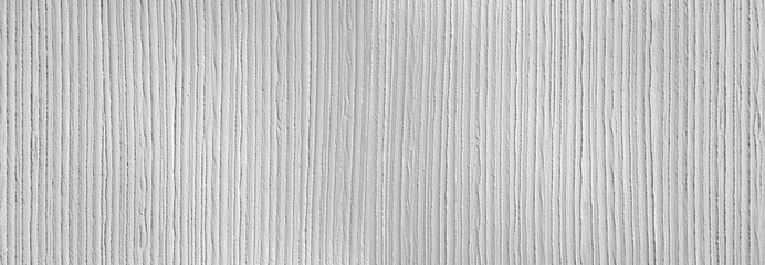 Fototapeta na wymiar Panorama einer weißen Wand aus grobem Putz mit vertikalem Streifenmuster
