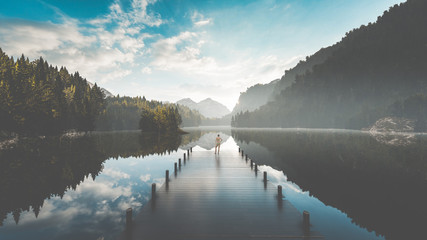 Bikini girls enjoying the sun by the lake