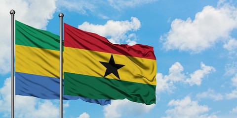 Gabon and Ghana flag waving in the wind against white cloudy blue sky together. Diplomacy concept, international relations.