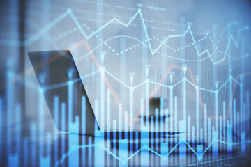 Double exposure of graph and financial info and work space with computer background. Concept of international online trading.