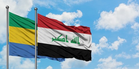 Gabon and Iraq flag waving in the wind against white cloudy blue sky together. Diplomacy concept,...