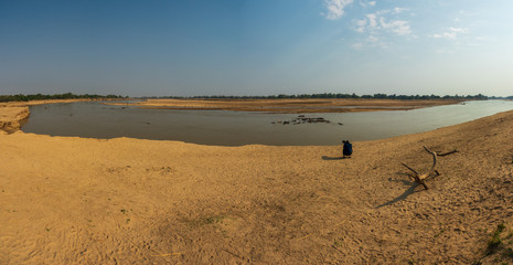 Photographer taking photos to hippos during safari