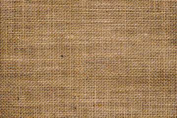 Rough hessian background with flecks of varying colors of beige and brown. with copy space. office...