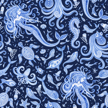 Seamless Baroque wallpaper pattern of indigo blue fairy tale sea animals and mermaid. Watercolor fantasy fish, octopus, dolphin, sea shells, bubbles, isolated on a dark indigo  background 