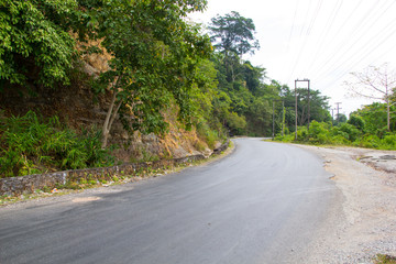 Fototapeta na wymiar Mountain road curve on the way to Khamkert lak20, borikhamxay Province, Laos