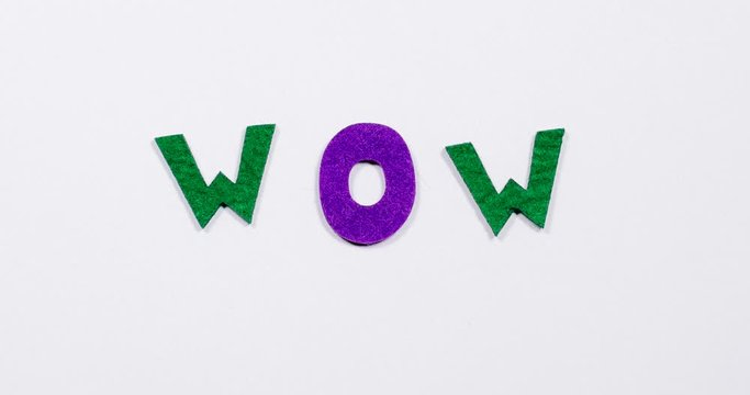 Word wow. The word is written in dancing, colorful letters.