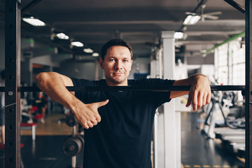Fototapeta na wymiar authentic image, portrait of healthy fit fitness coach in a gym. concept of active living and weight loss success