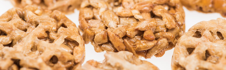 close up view of delicious Gozinaki isolated on white, panoramic shot