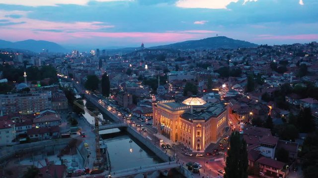 Aerial/drone shot of Sarajevo City Hall taken during sunset.