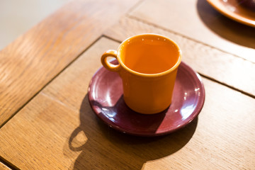 Color mug on wooden table