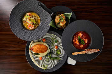 top view of delicious restaurant dishes on wooden table