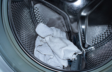 laundry room background. washing machine with dirty towels