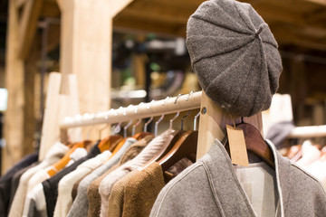 Warm winter ladies clothes(knit) on hangers.
