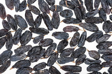 top view of black raisins isolated on white