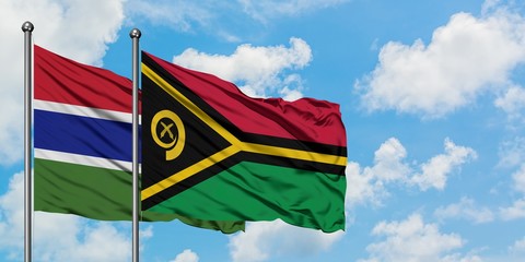 Gambia and Vanuatu flag waving in the wind against white cloudy blue sky together. Diplomacy concept, international relations.