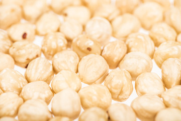 close up view of hazelnut scattered isolated on white