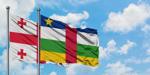 Georgia and Central African Republic flag waving in the wind against white cloudy blue sky together. Diplomacy concept, international relations.