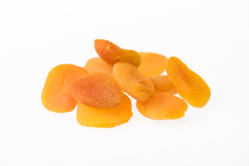 Fototapeta na wymiar heap of delicious dried apricots isolated on white