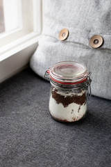 Obraz na płótnie Canvas Vegan Chocolate brownie ingredients in a glass jar