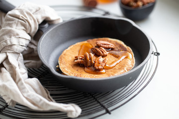 Pancakes with banana, walnuts and honey. Morning concept