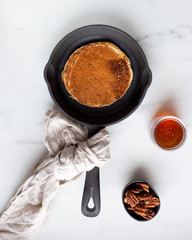 Pancakes with banana, walnuts and honey. Morning concept