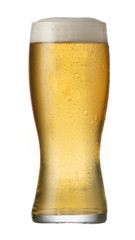 A cold white beer poured from a tap into a chilled glass with a delicious foam head.