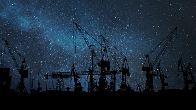 Big Cranes in the Port of Hamburg, Time Lapse by Night with Stars and Milky Way, Germany, Europe